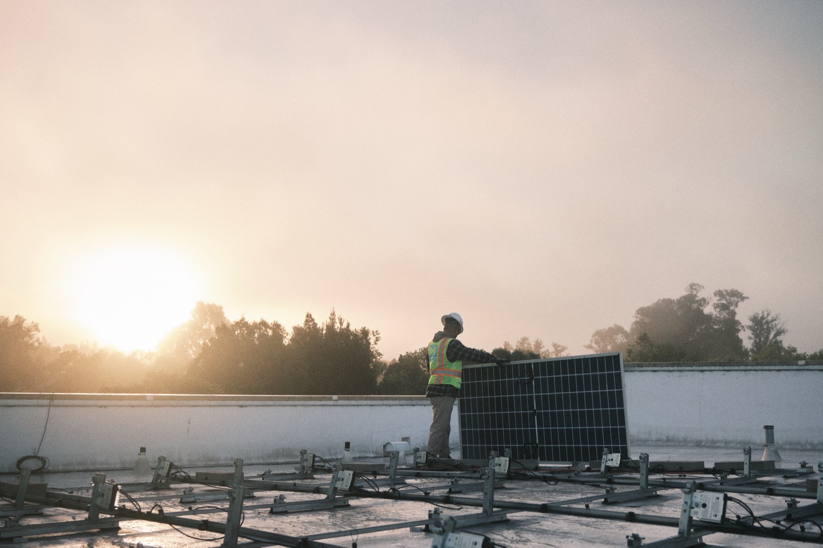 MYNT electrician working on a commercial solar installation